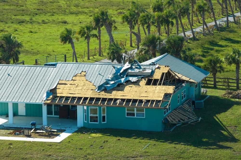 A home with a severely damaged roof.