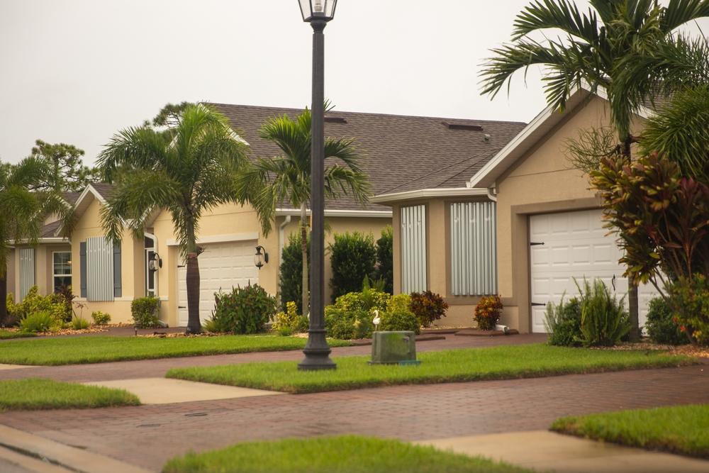 A row of homes with hurricane shutters.