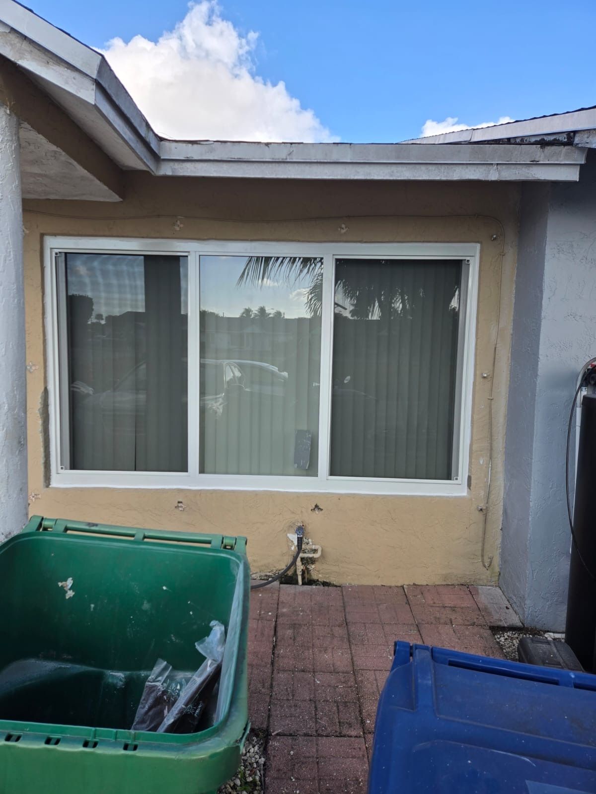 Impact window white frame in florida home - 3 oanels