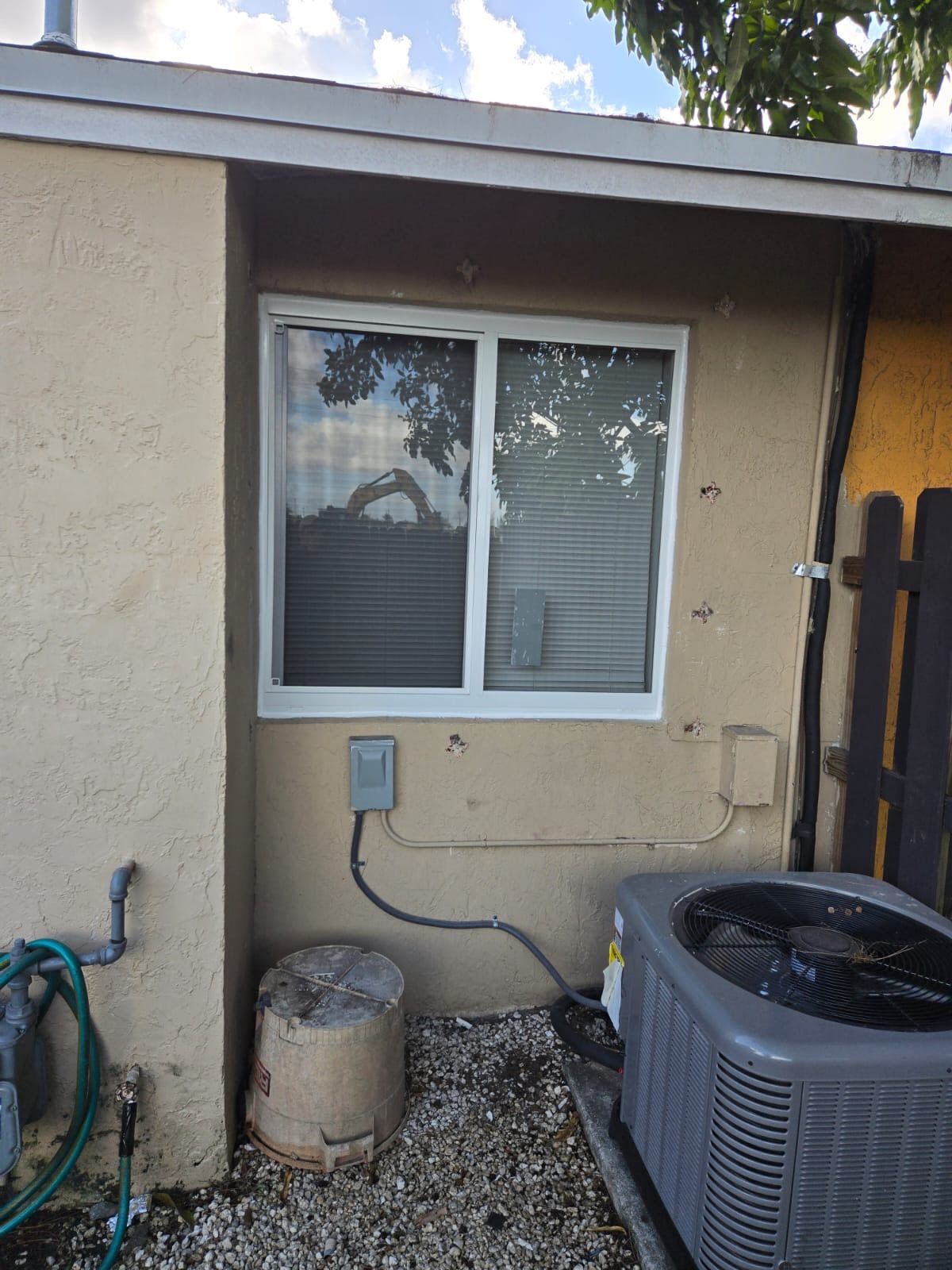 Sliding Impact window white frame in florida home
